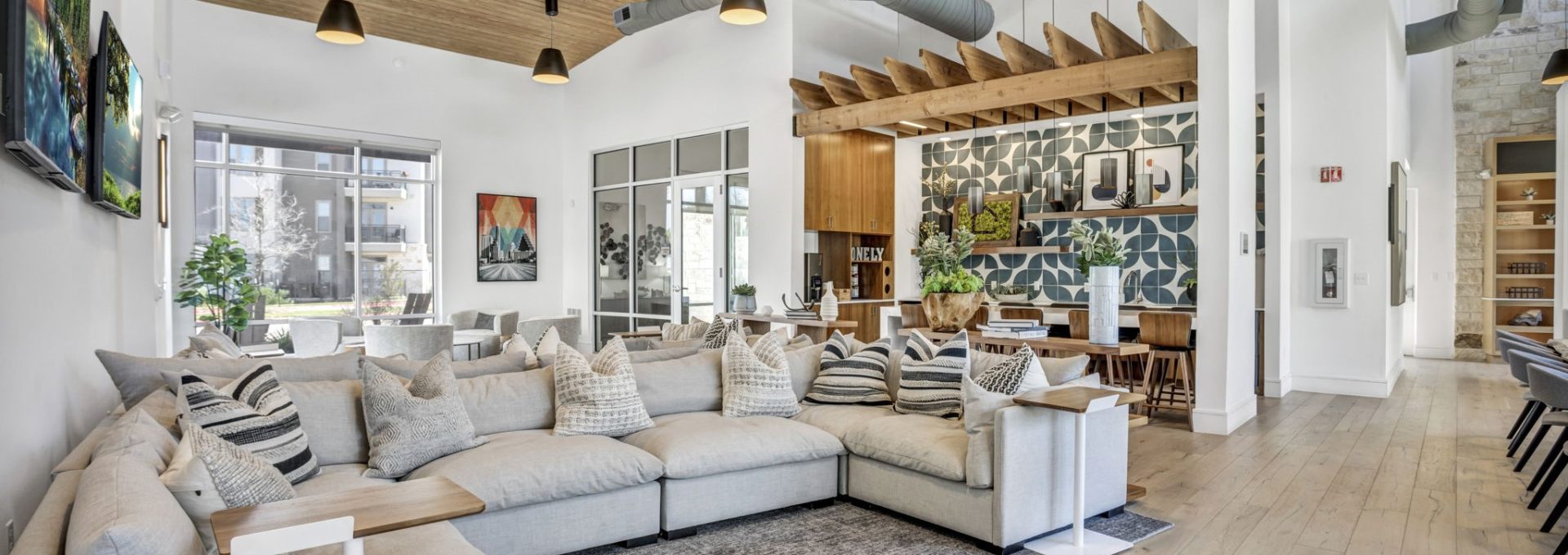 a large living room with a couch, coffee table and a large painting at The  Conley