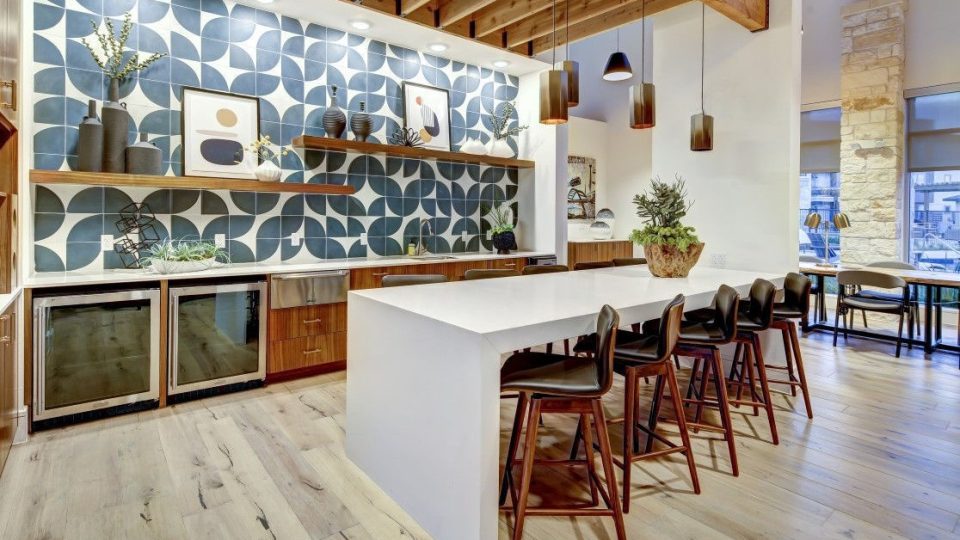 a kitchen with a large island and wood floors at The  Conley