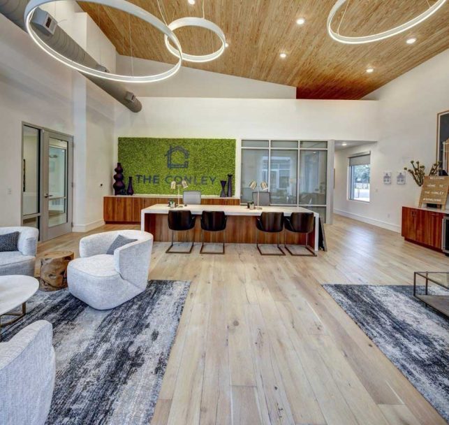 the modern office has a wood ceiling and a large open space at The  Conley