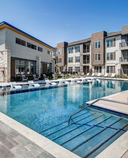 large pool with lounge chairs